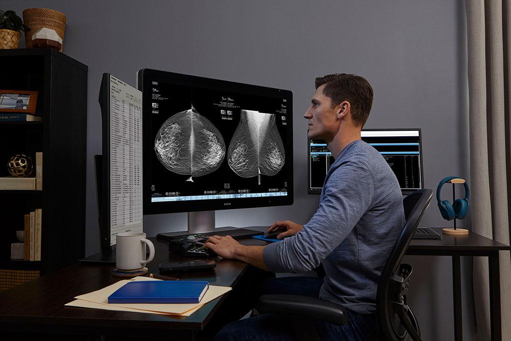 Provider looking at x-rays on monitor
