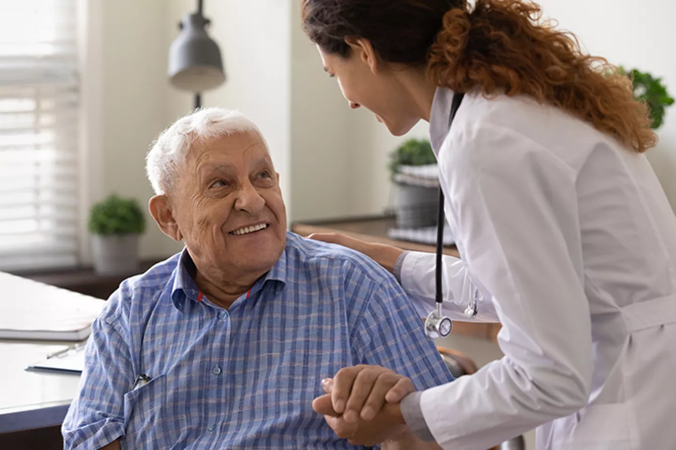 Old male patient meeting with a physician