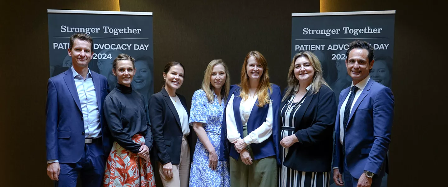 Group photo in front of banners